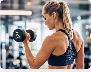 Woman exercising with dumbbell